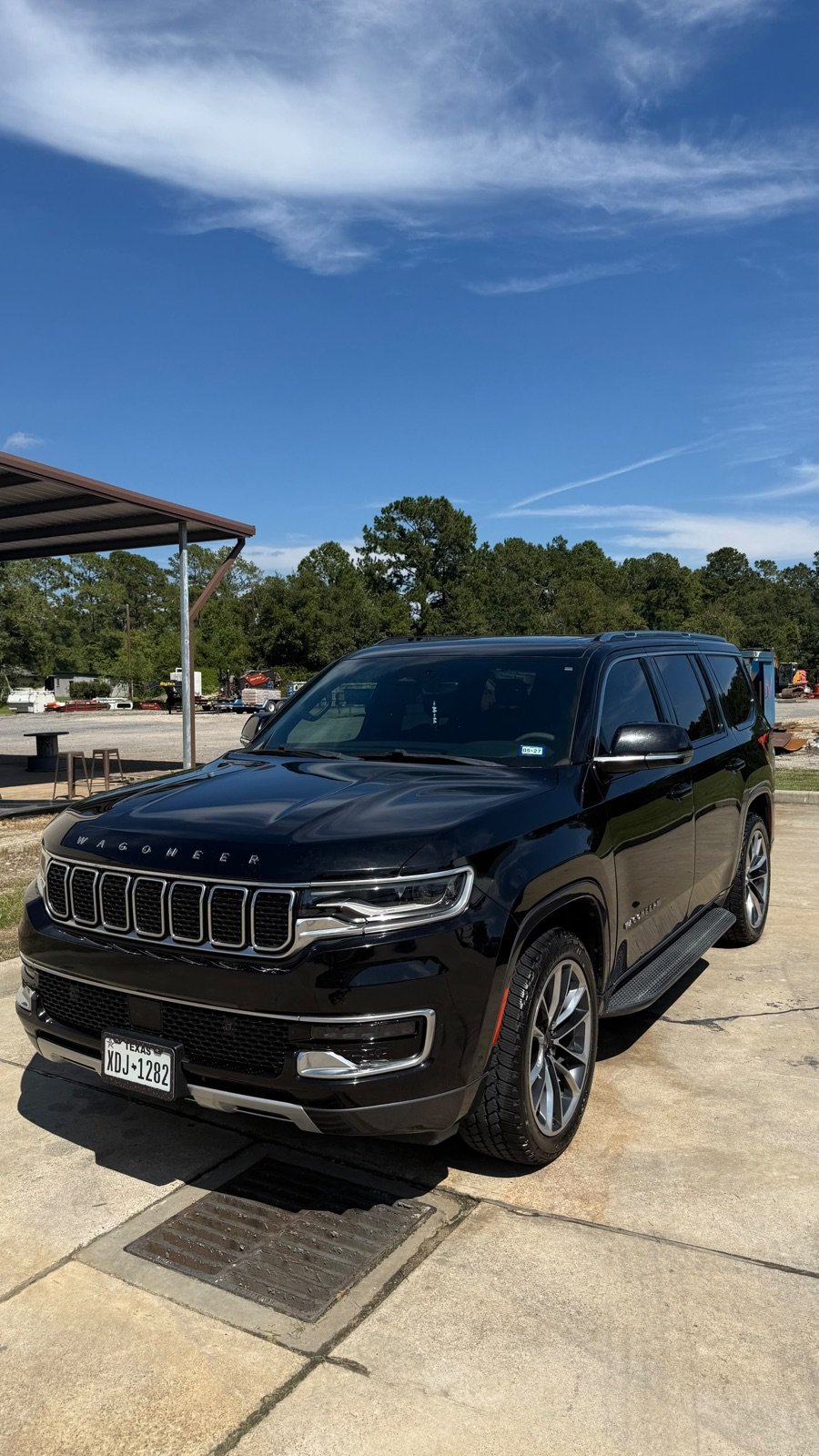 Black Jeep Wagoneer after a full exterior detail